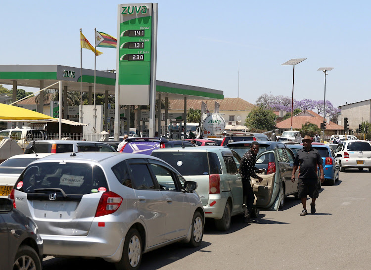 Motorists queue to buy petrol in Harare, Zimbabwe, on October 8 2018. Protests erupted in Harare and Bulawayo on Monday after President Emmerson Mnangagwa announced fuel price hikes of more than 100% at the weekend.