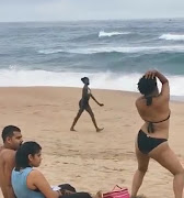 A woman walked up to a random couple on a beach south of Durban and started to swear, twerk and perform  raunchy moves.