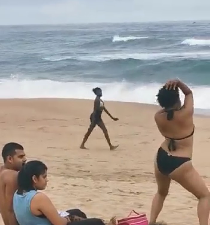 A woman walked up to a random couple on a beach south of Durban and started to swear, twerk and perform raunchy moves.