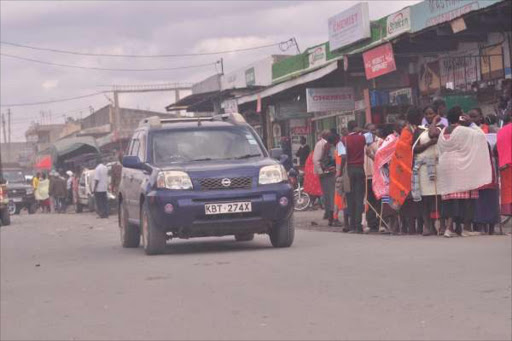On the prowl: A group of Maasai women in Isinya town last month. Police stopped them from invading bars, hair salons and M-Pesa outlets in search of ‘husband snatchers’.