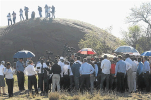 INSPECTION IN LOCO: Retired judge Ian Farlam led lawyers, police officers, union officials and members of the media on a site inspection of the Marikana 'koppie' where the miners were killed. PHOTO: MOHAU MOFOKENG