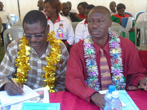 Knut Assistant Secretary General Hesbon Otieno and Bungoma central executive secretary Fred Sichangi during Bungoma south KNUT AGM held at the redcross hall. /FILE