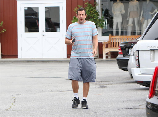 Adam Sandler takes refuge in baggy shorts.