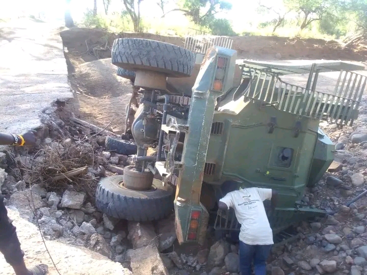 A man tries to see through the police anti mine vehicle that was involved in accident..