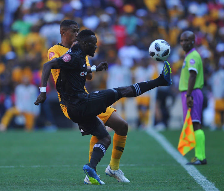 Augustine Mulenga of Orlando Pirates is challenged by Mario Booysen of Kaizer Chiefs during the Absa Premiership match at FNB Stadium in Johannesburg on October 27, 2018 at FNB Stadium.