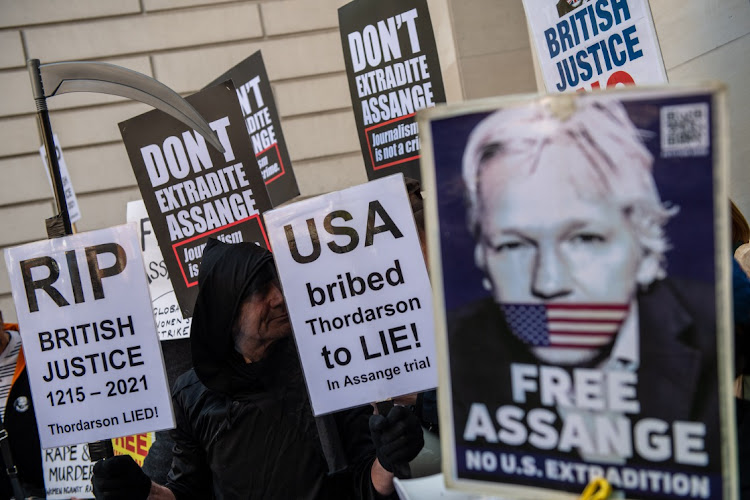 Supporters of Julian Assange protest outside court before an extradition hearing at The City of Westminster Magistrates Court on April 20, 2022 in London, England. The Wikileaks founder faces extradition to the US and conspiracy and hacking charges, which he denies.