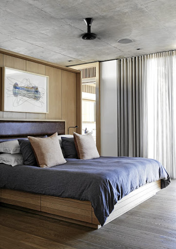 In the main bedroom, the oiled-oak bed unit was designed by Malan Vorster.