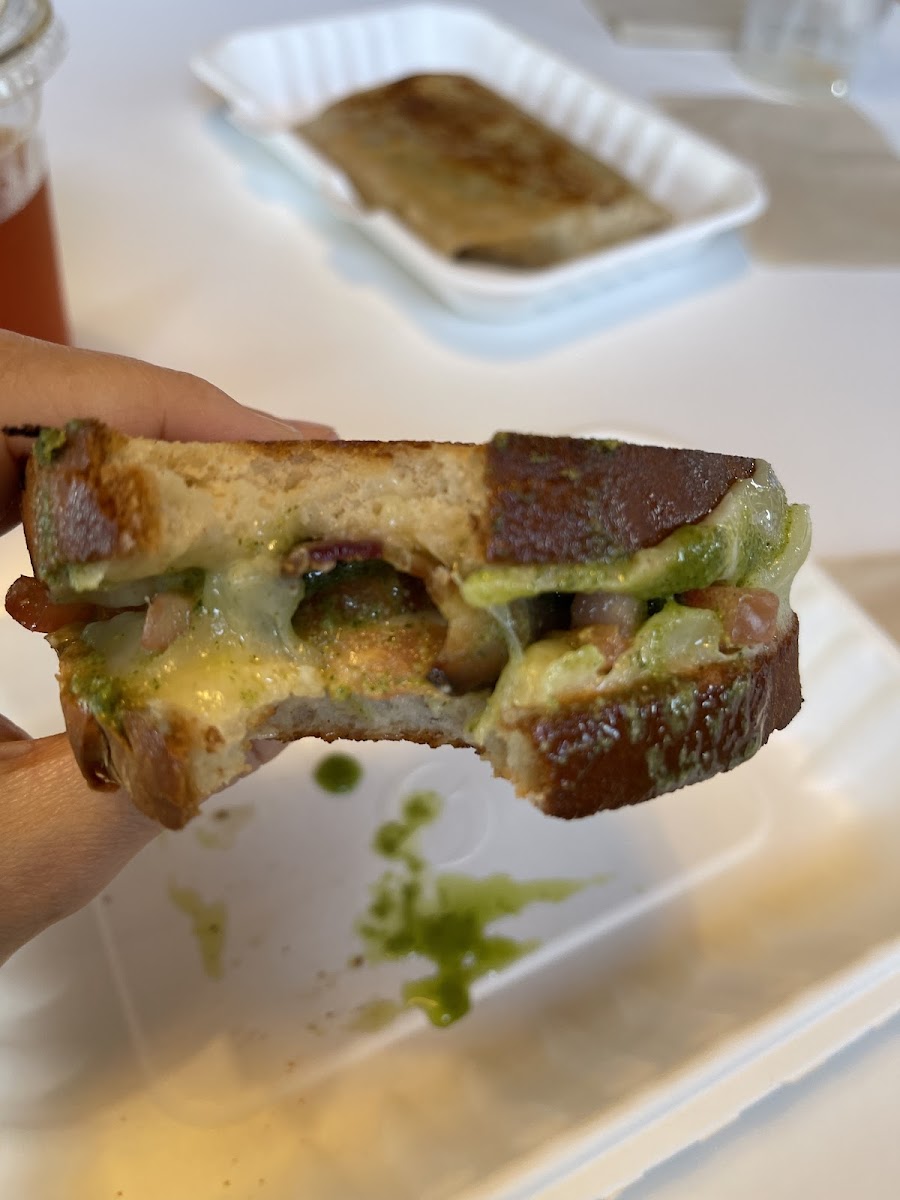 Grilled cheese with cheddar, tomato, bacon, and pesto
