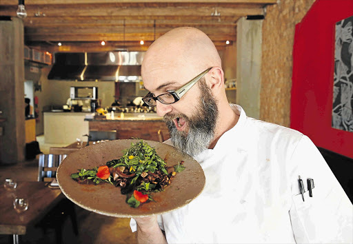 FRESHLY FOUND: Chris Erasmus, with a plateful of foraged and natural ingredients, handpicked and plated