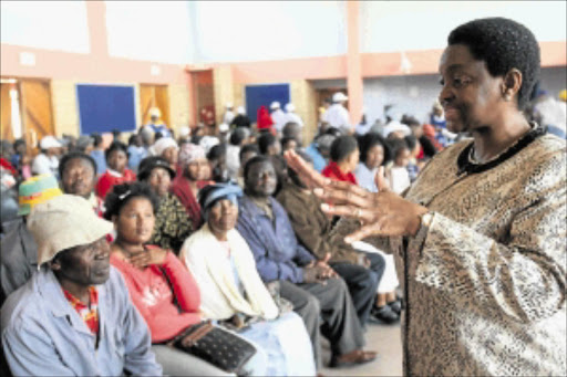 ALL EARS: Minister of Social Development Bathabile Dlamini visits a pension pay point in Diepkloof yesterday to check if the new system is unfolding as envisaged. PHOTO: ANTONIO MUCHAVE