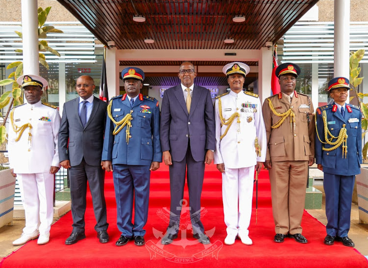 Chief of Defence Forces (CDF) General Charles Kahariri with Defence CS Aden Duale during a change of guard at the DoD in Nairobi on May 7, 2024.