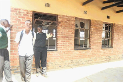 BAD STATE: Pupils stand outside a classroom of the dilapidated Refilwe Secondary School in Klopper, Limpopo, which does not have ceilings and windows. PHOTO: MABUTI KALI