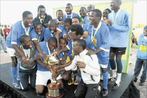 YOUNG LIONS: Mokopane Academy players celebrate after winning the 2009 Kay Motsepe schools soccer tournament at Oscar Mpetha Stadium in Limpopo. Photo: CHESTER MAKANA