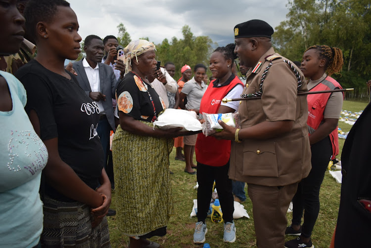 Homa Bay county commissioner Moses Lilan distributes food to flood affected persons at Osodo primary in Karachuonyo constituency on May 9, 2024