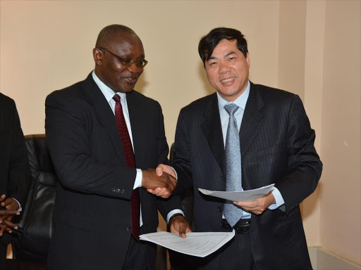 Development boost: Kisii governor James Ongwae and Boleyn Magic Wall Panel MD Jack Liu when they signed the MoU in a ceremony in the governor’s office.