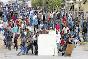 Protesters brave police rubber bullets in Grabouw, Cape Town Picture: SHELLEY CHRISTIANS