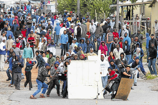 Protesters brave police rubber bullets in Grabouw, Cape Town Picture: SHELLEY CHRISTIANS
