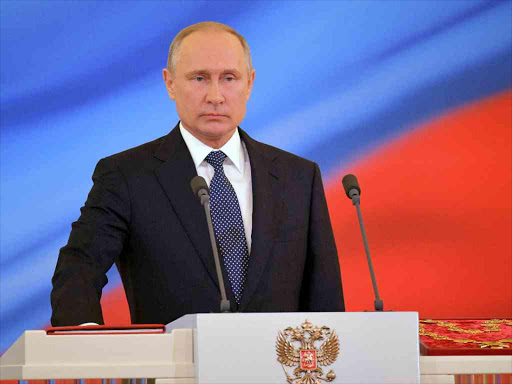 Russian President Vladimir Putin takes the oath during an inauguration ceremony at the Kremlin in Moscow, Russia May 7, 2018. /REUTERS