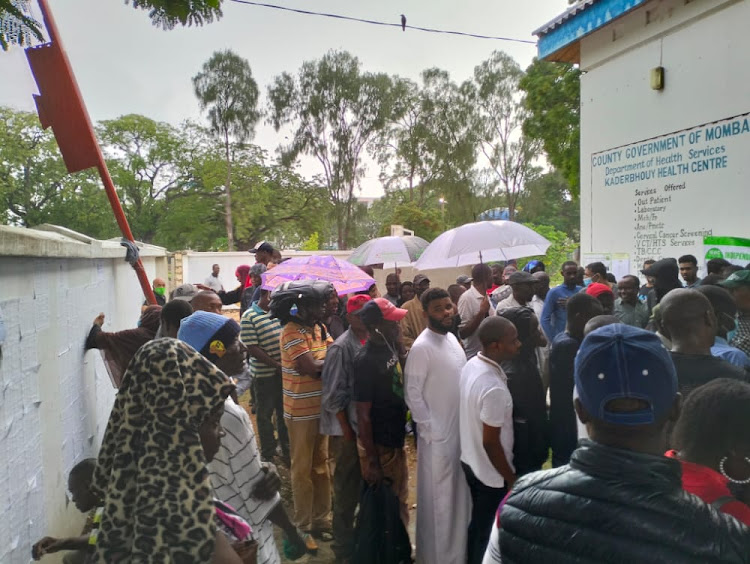 Voters brace the chilly weather outside Kaderbhouy Health Center