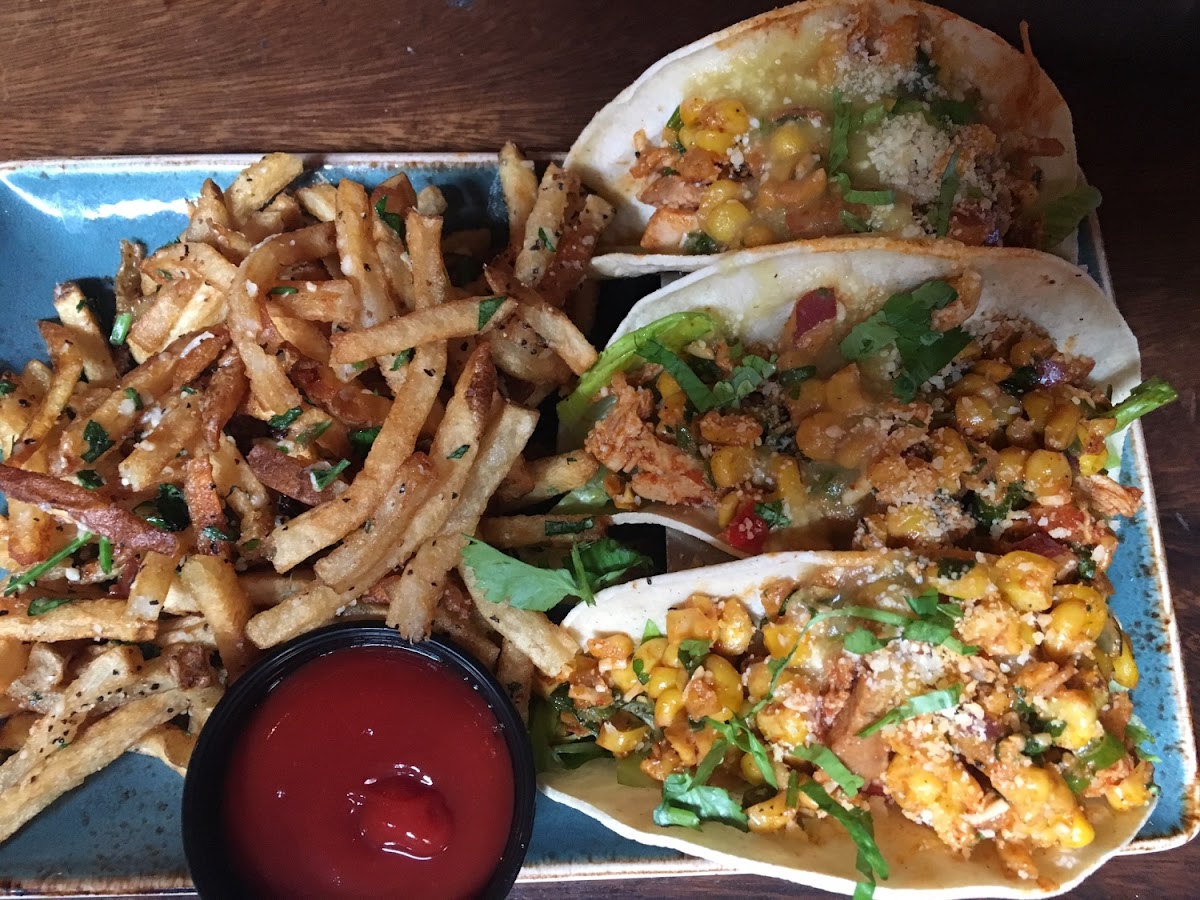 Street tacos (chicken tinga) and truffle fries.   Tinga spice is spicy, but excellent.