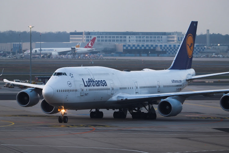 A Lufthansa plane stands parked as Frankfurt airport. Picture: REUTERS/KAI PFAFFENBACH