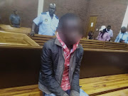 The prime suspect in the murder of seven women and children in Vlakfontein sits in the dock at the Lenasia Magistrate's Court.