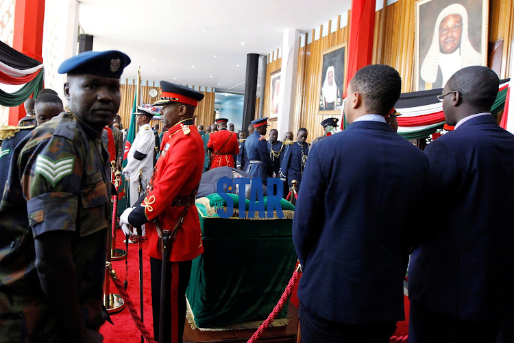 Military officers guard as the body of late former Kenya's President Daniel Arap Moi, lay-in-State for public viewing at the Parliament Buildings in Nairobi, Kenya February 8, 2020.