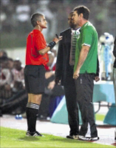 GRAVE ERROR: Referee Abdul Ebrahim warns then Bloemfontein Celtic coach Mich D'Avray for protesting too much. The ref had wrongfully shown Celtic's Geoffrey Sserunkuma a red card in a Telkom Knockout Challenge match against Orlando Pirates at Chatsworth Stadium in Durban. 29/11/2008. Pic. Anesh Debiky. © Gallo Images