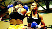 Nozipho Bell, the junior-lightweight titlist,  right, in an earlier  bout against Nomampondomise Xotyeni. 