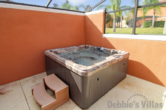 Free-standing hot tub on the west-facing patio area of this Kissimmee vacation home