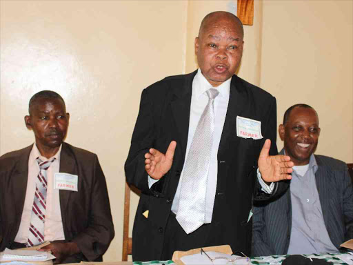 Peasant Coffee Farmers Association of Kenya chairman Peter Wangonya addressing farmers in Murang'a town,