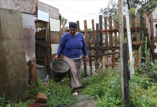 Walmer Area G West resident Ntombizanele Makhaphela is one of many who look forward to the end of the hated bucket toilet system.