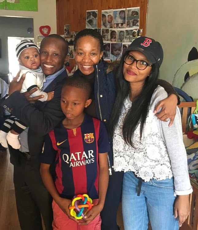 Baby Lotanang, proud parents Sholto and Thabitha Dolamo, the writer Zipho and younger brother Phetolo picking up the new family member at Angels Baby Sanctuary in 2016.