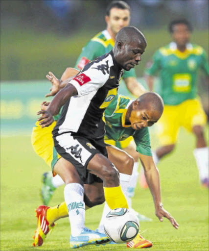 IN A TUSSLE: Kingston Nkhatha holds off Siyabonga Nkosi during the Absa Premiership match between Golden Arrows and Black Leopards at Princess Magogo Stadium in Durban last night. Photo: Gallo Images