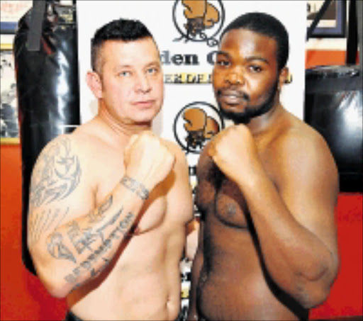 LETHAL WEAPONS: Heavyweight boxers Basil Ray, left, and Bull Muravha will square up at Emperors Palace in Ekurhuleni next month. 13/03/2009. © Sowetan. Pic. Vathiswa Ruselo.