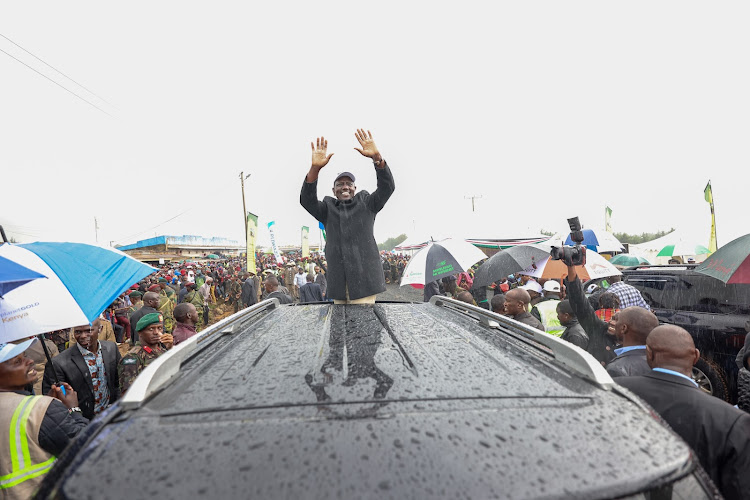 President William Ruto braving rains while addressing residents of Kuresoi North Constituency, Nakuru on January 13, 2024
