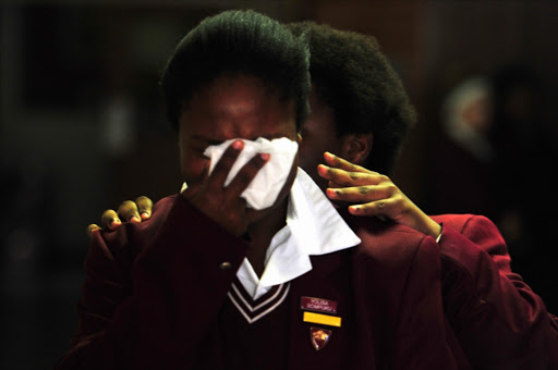 Pupils and fellow teachers of Riebeek College Girls High School reel with shock at the announcement that the body of Jayde Panayiotou was found on April 22, 2015 in Port Elizabeth, South Africa.