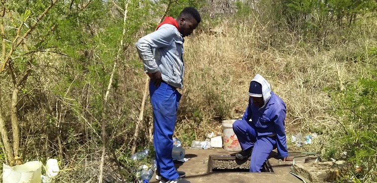 Asiphe Diko gets dirty water from a drain in the Dutywa area of the Eastern Cape.