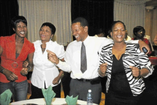 HAPPY TIME: Nelly Dube, Bellina Dube, Elphas Vulindlela Dube, principal of Daveyton Intermediate School, and Thandi Dube at a party in Boksburg, Ekurhuleni. PHOTO: ANTONIO MUCHAVE