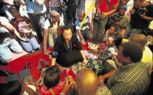 SHOWING SOLIDARITY: Former first lady Graca Machel speaking to family members of Mido Macia, the taxi driver and Mozambican national who was tied to the back of a police van and dragged along a street in Daveyton. He died in a police cell two hours later. PHOTO: SIZWE NDINGANE