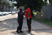An altercation broke out between a metro police officer and a striking Transnet employee after he tried to block the road from Victoria Embarkment to the Transnet terminal in Bayhead.