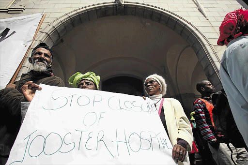 Protesters in front of the provincial legislature in Cape Town call for plans to close the GF Jooste Hospital for three years to be abandoned