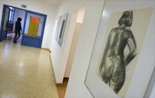 A painting depicting a nude woman by Berlin artist Susanne Schueffel hangs in a hallway of the Marzahn-Hellersdorf Volkshochschule (VHS - a German adult high school) in Berlin.