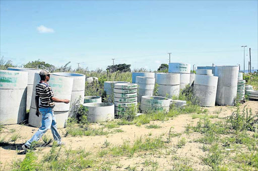 ON HOLD: Piles of material meant for bulk water and sanitation in Mdantsane's Gqozo Village in NU1 is left unattended Picture: SINO MAJANGAZA
