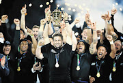 VICTORIOUS: Richie McCaw of New Zealand lifts the trophy after the Rugby World Cup final against Australia on October 30, 2015.