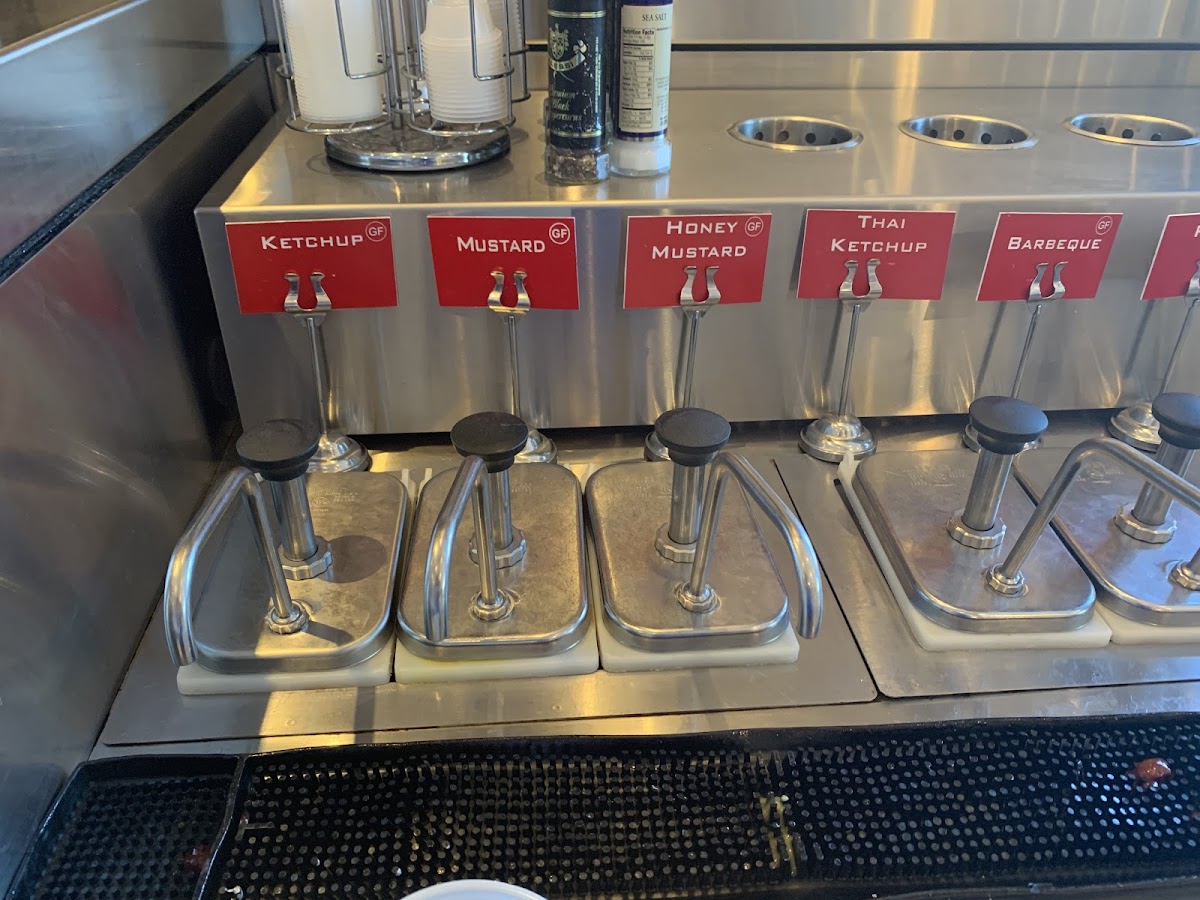 Clearly labelled self serve condiments - many GF