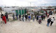 Voters queue outside a Khayelitsha voting station in Cape Town.