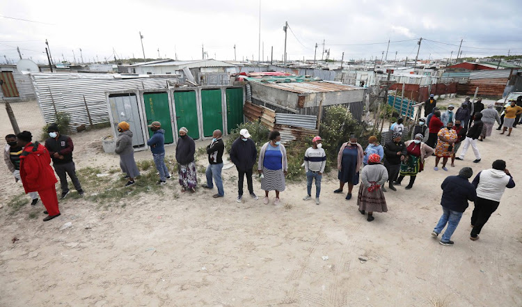 Voters queue outside a Khayelitsha voting station in Cape Town.