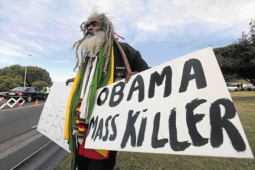 A demonstrator outside the University of Cape Town, where US President Barack Obama spoke yesterday