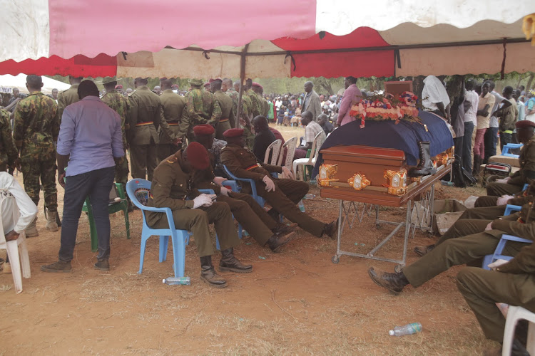 GSU officers gather to bury their slain colleague John Kisoi during an emotional send-off at his Kukui home in Baringo North on Saturday, October 8.